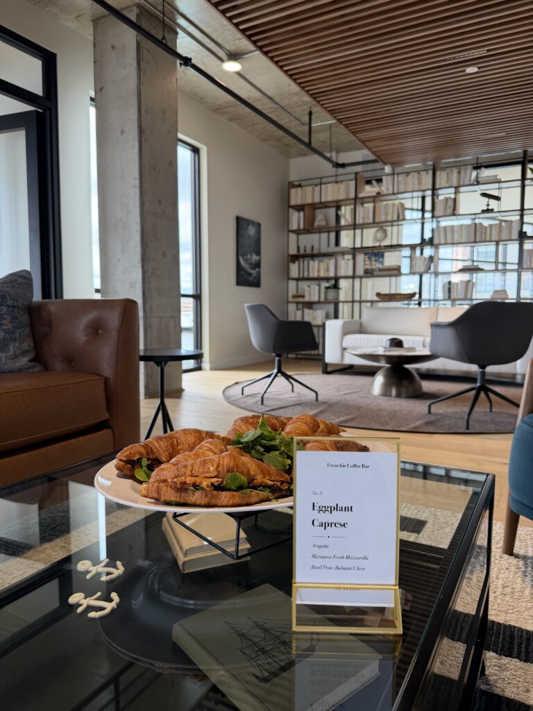 Eggplant caprese croissant sandwiches from Frenchies Coffee Bar served in the lounge at The August, Bridgeport CT