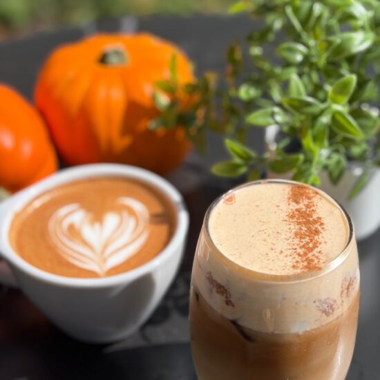 Hot and iced pumpkin spice lattes with pumpkins at Frenchies Coffee Bar