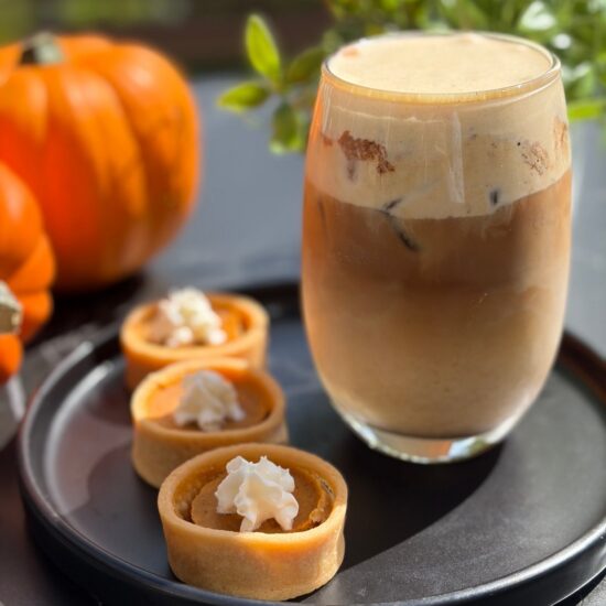 Iced pumpkin spice latte with pumpkin spice cold foam and mini pumpkin pies at Frenchies Coffee Bar